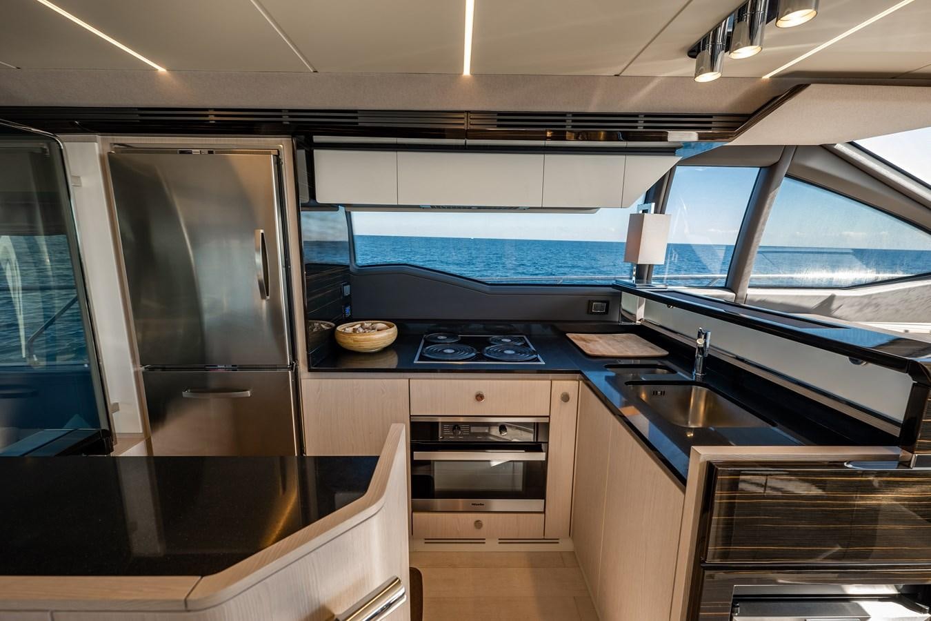 a kitchen with a stove and a sink aboard KNOT DIVORCE Yacht for Sale
