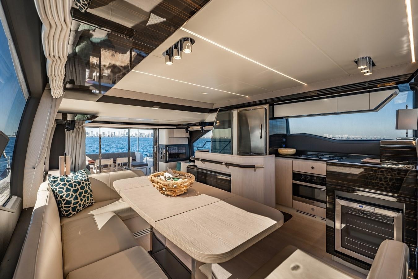 a kitchen with a table and a couch aboard KNOT DIVORCE Yacht for Sale