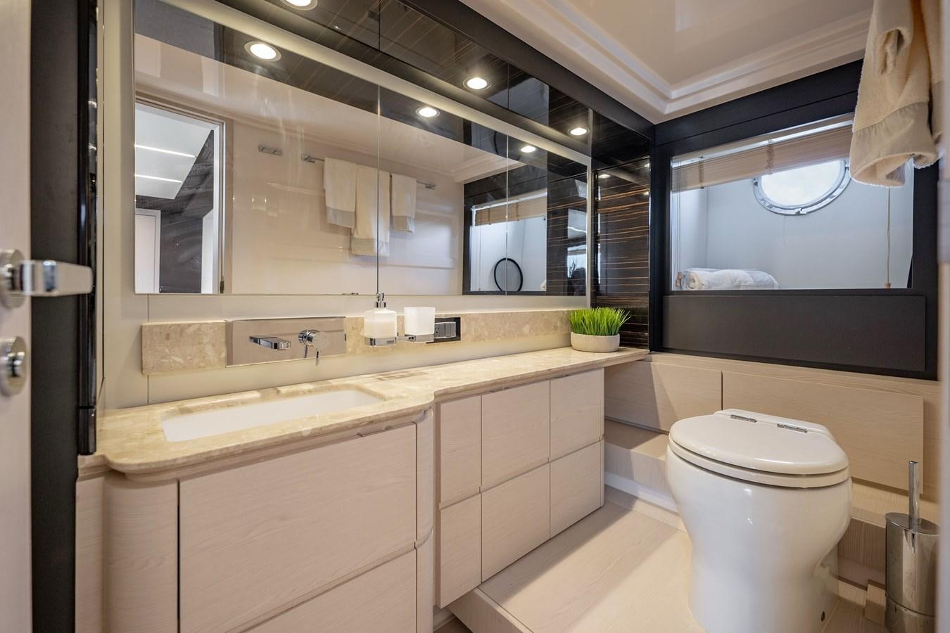 a bathroom with a toilet and a sink aboard KNOT DIVORCE Yacht for Sale