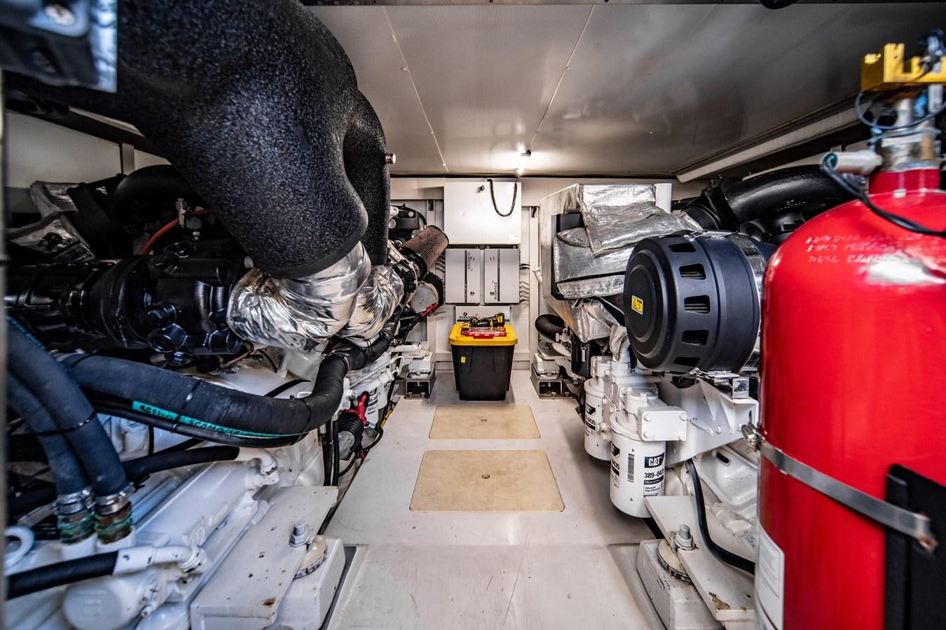 a person working on a machine aboard KNOT DIVORCE Yacht for Sale