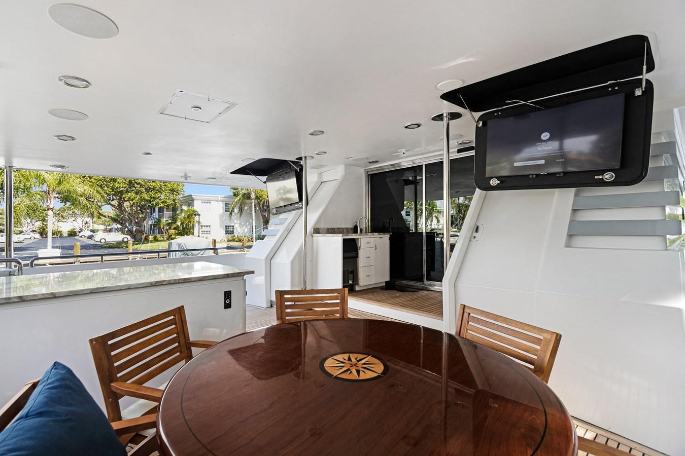 a kitchen with a table and chairs aboard MAC Yacht for Sale