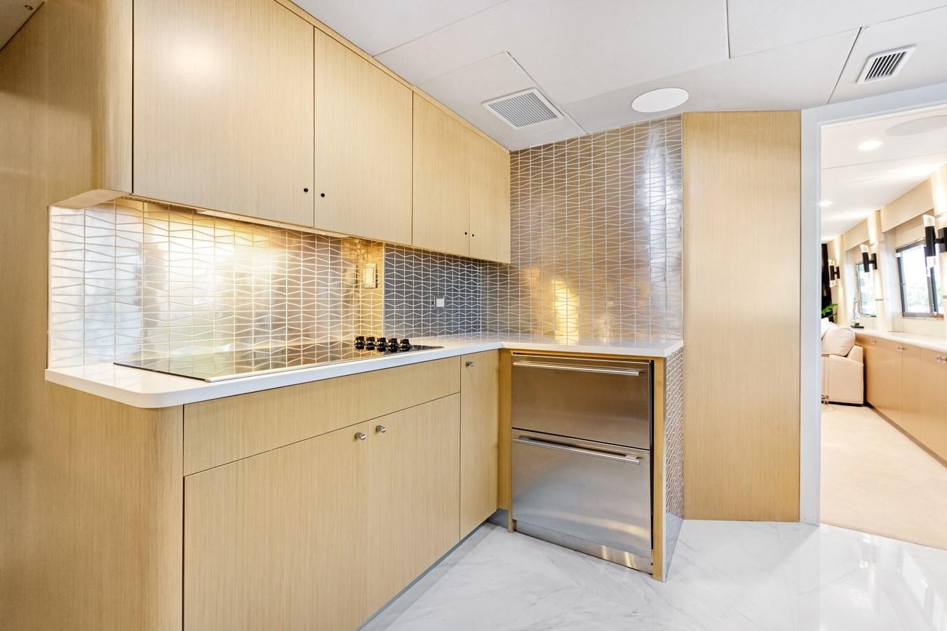 a kitchen with a large counter aboard MAC Yacht for Sale