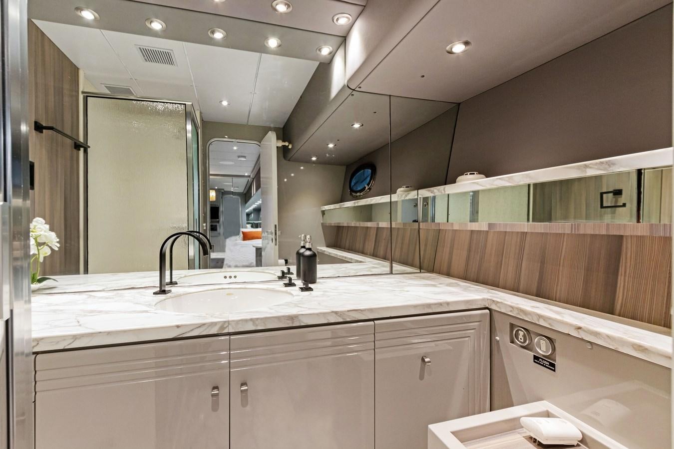 a bathroom with a large mirror aboard MAC Yacht for Sale