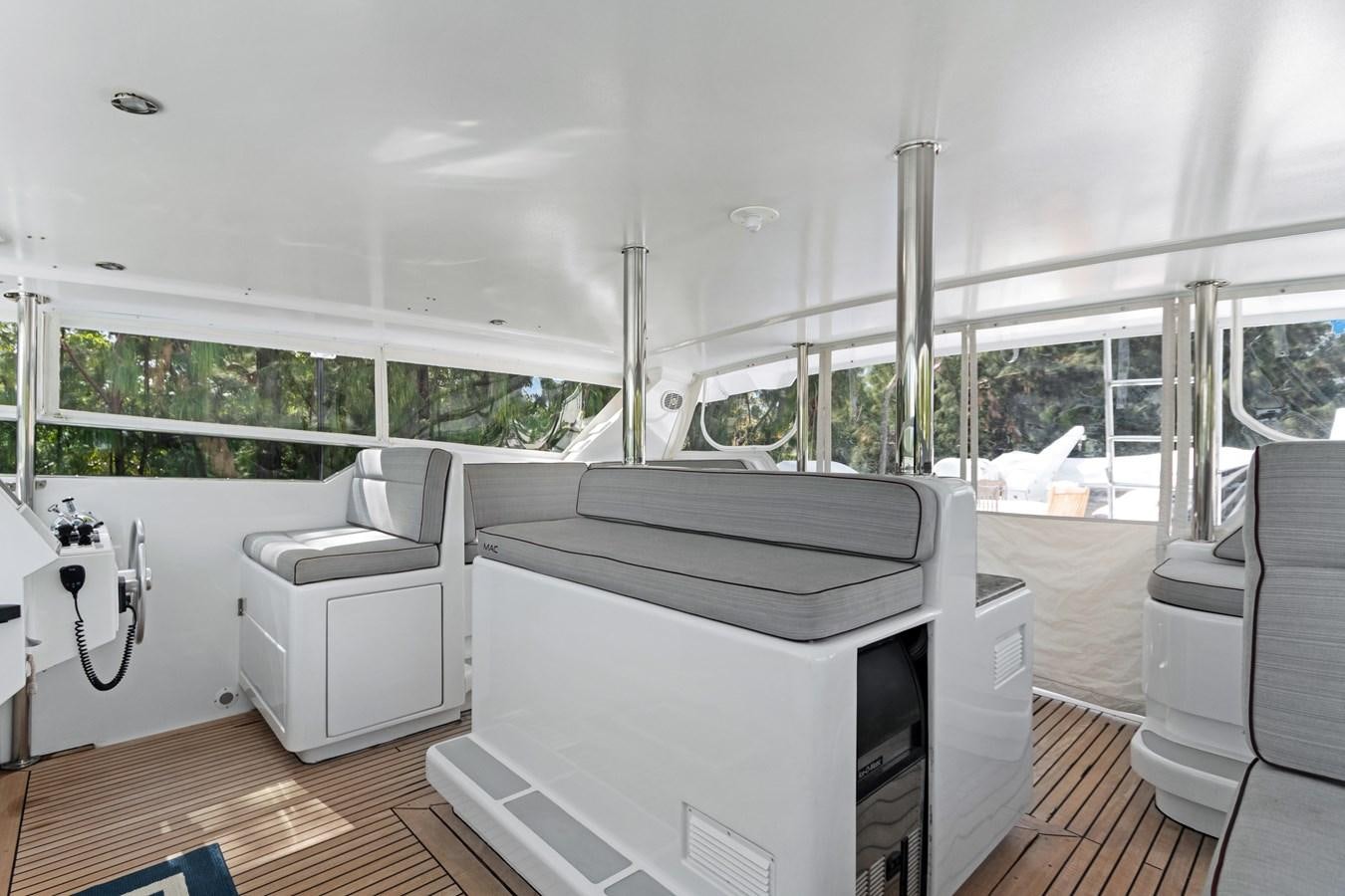 a room with a large window and a desk with a computer aboard MAC Yacht for Sale