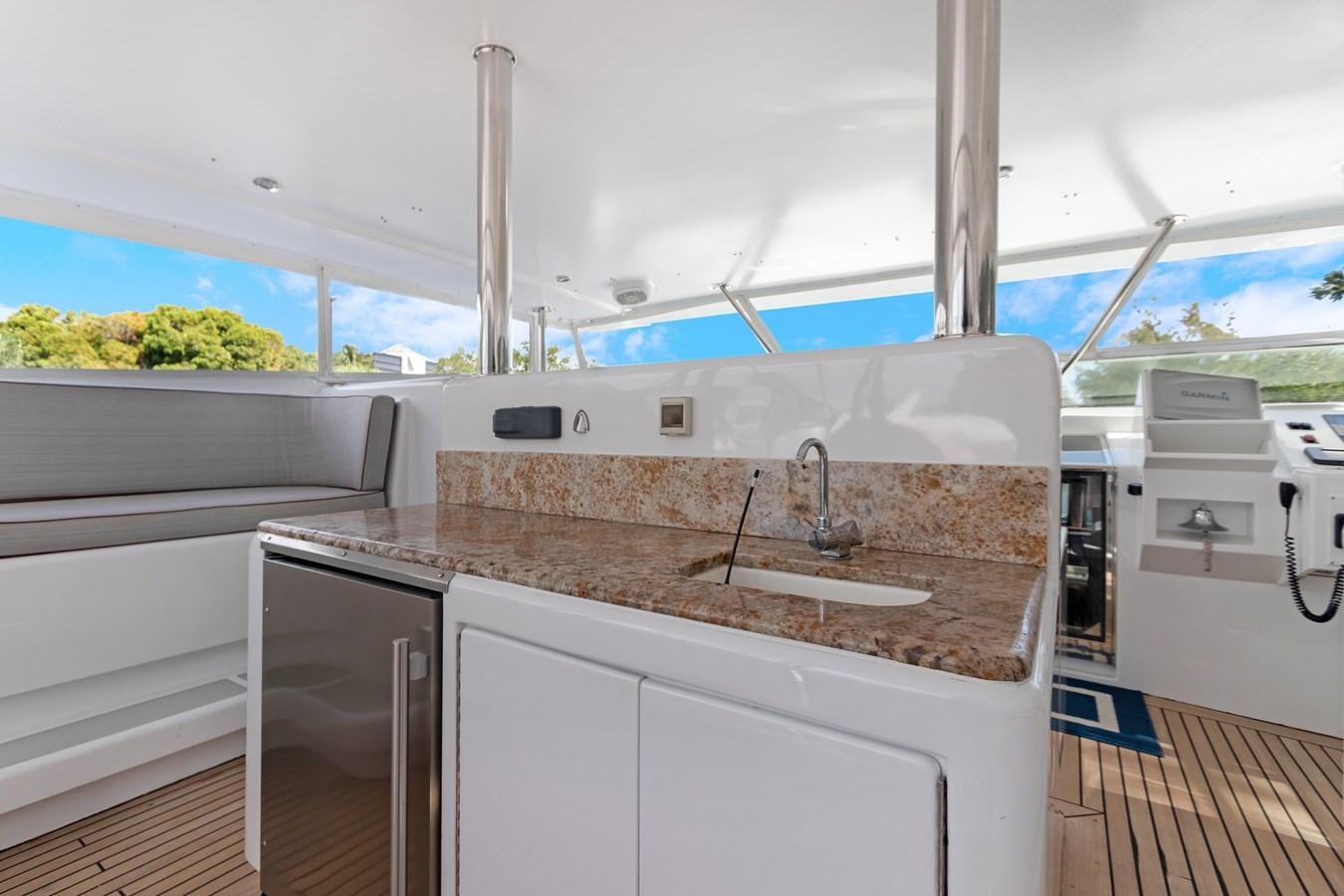 a kitchen with a sink and a large window aboard MAC Yacht for Sale