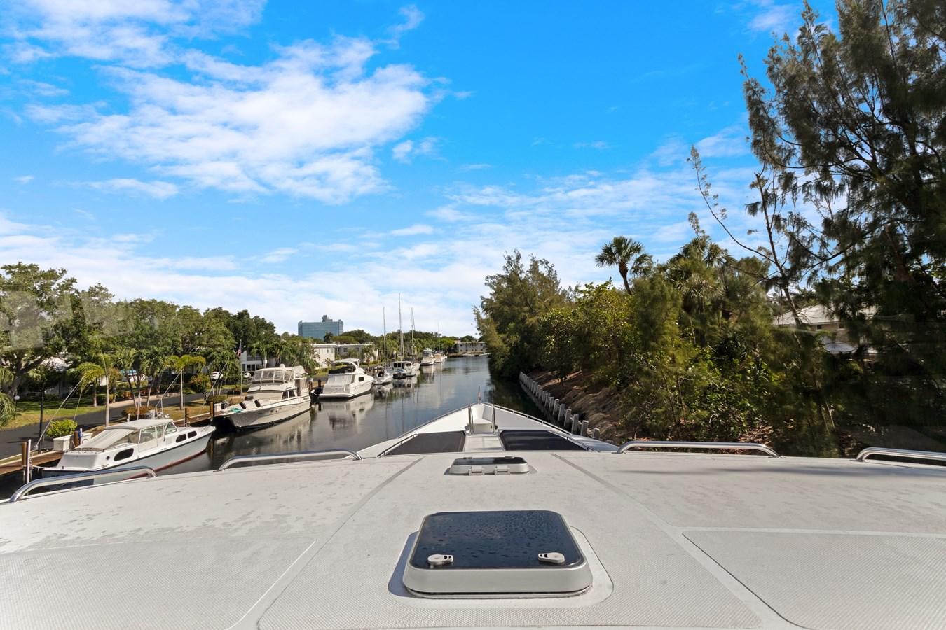 a laptop on a table aboard MAC Yacht for Sale