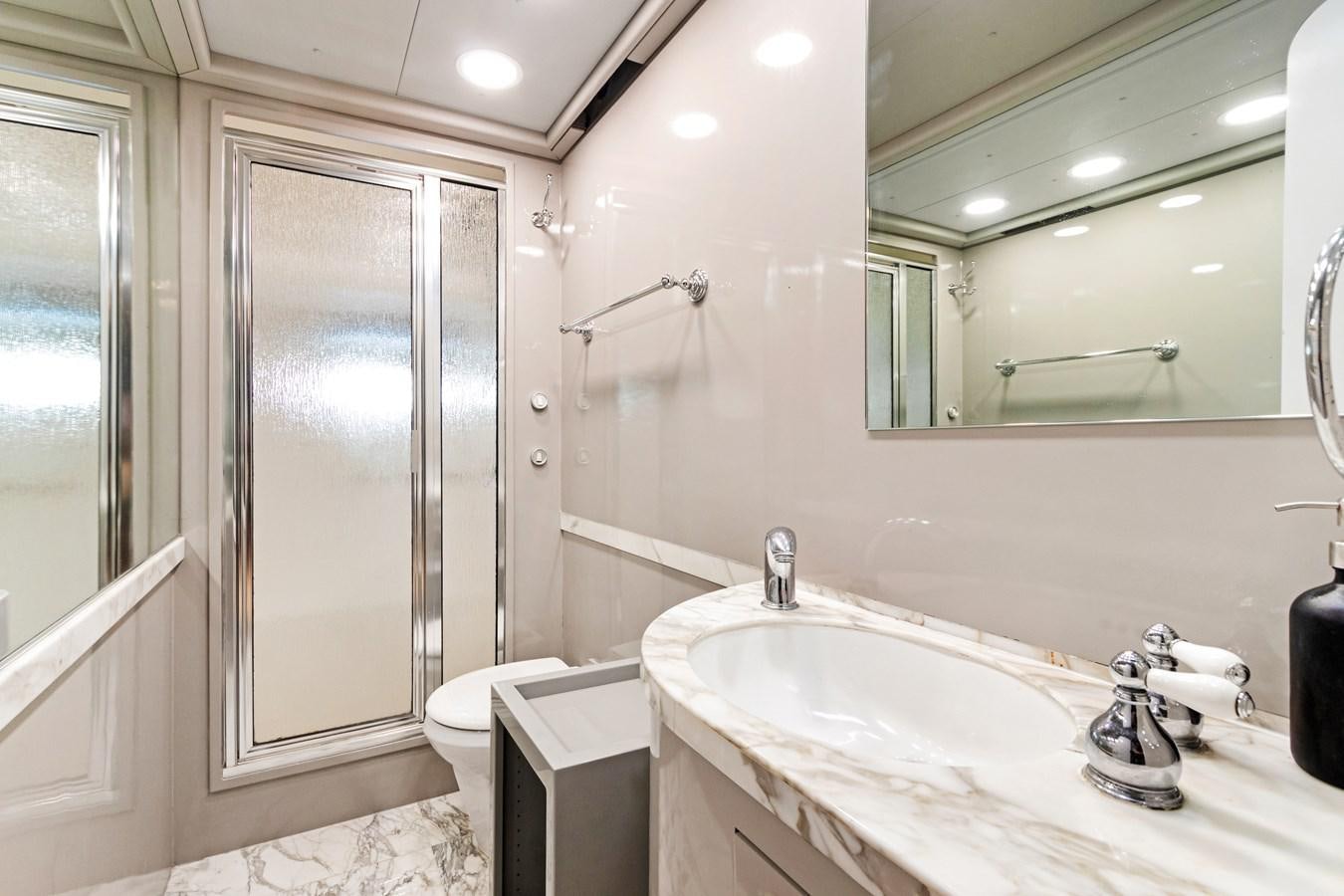 a bathroom with a sink and a mirror aboard MAC Yacht for Sale