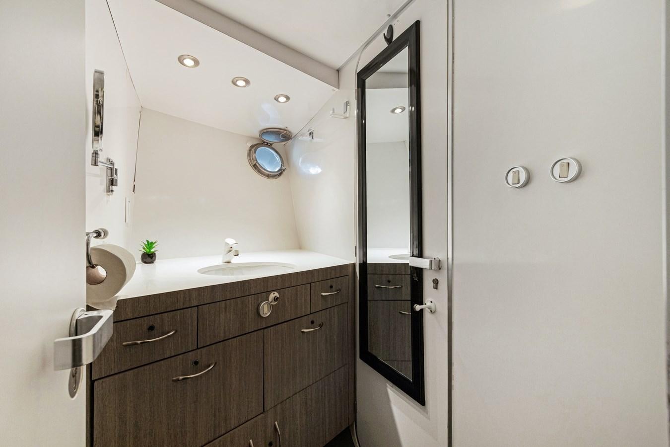 a bathroom with a sink and a mirror aboard MAC Yacht for Sale