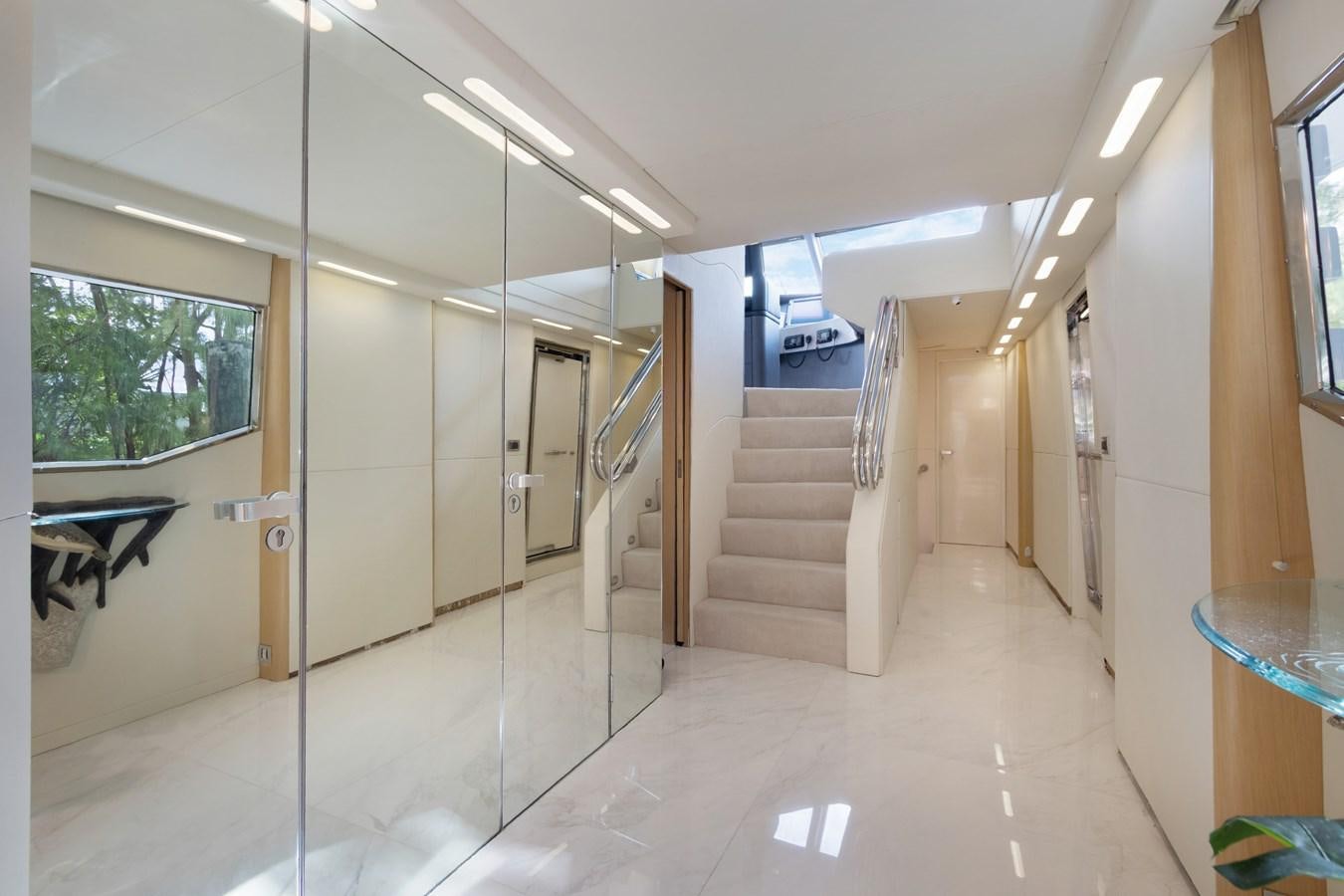 a hallway with a glass door aboard MAC Yacht for Sale