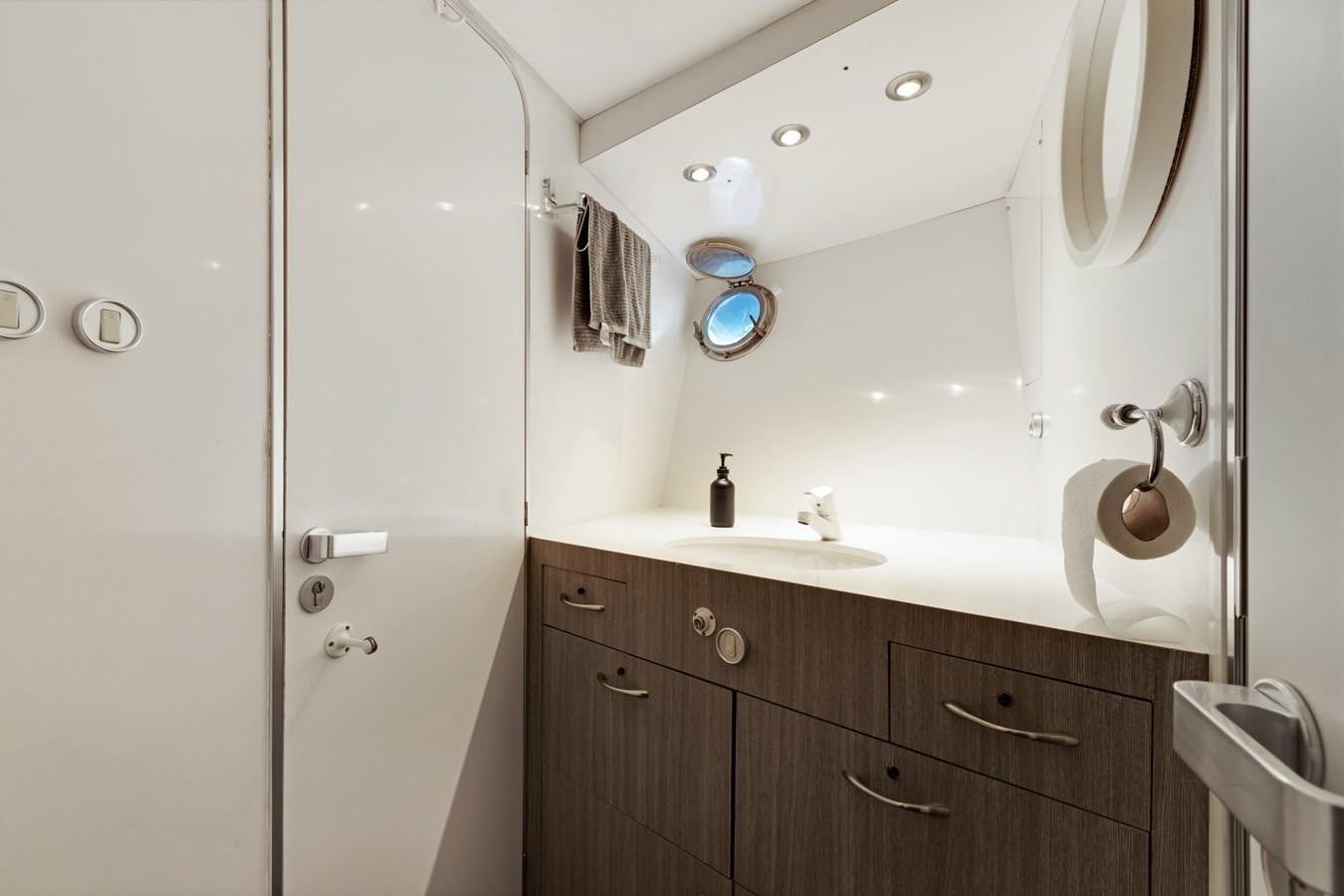 a bathroom with a sink and a shower aboard MAC Yacht for Sale