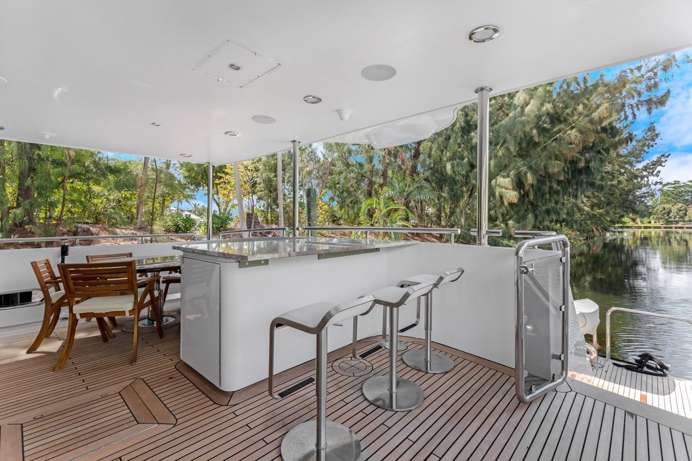 a large white table with chairs on it aboard MAC Yacht for Sale