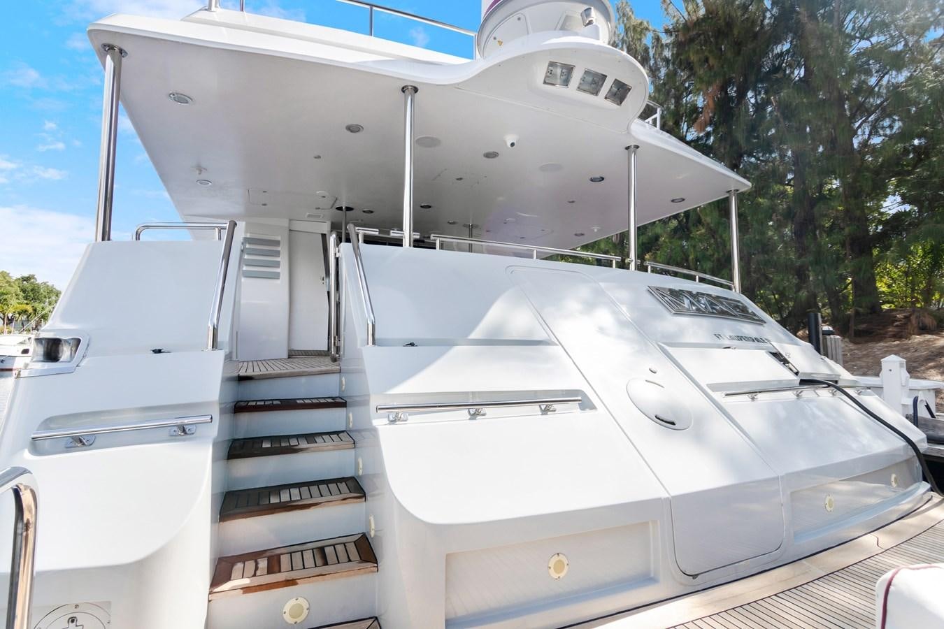 a white boat with a staircase aboard MAC Yacht for Sale