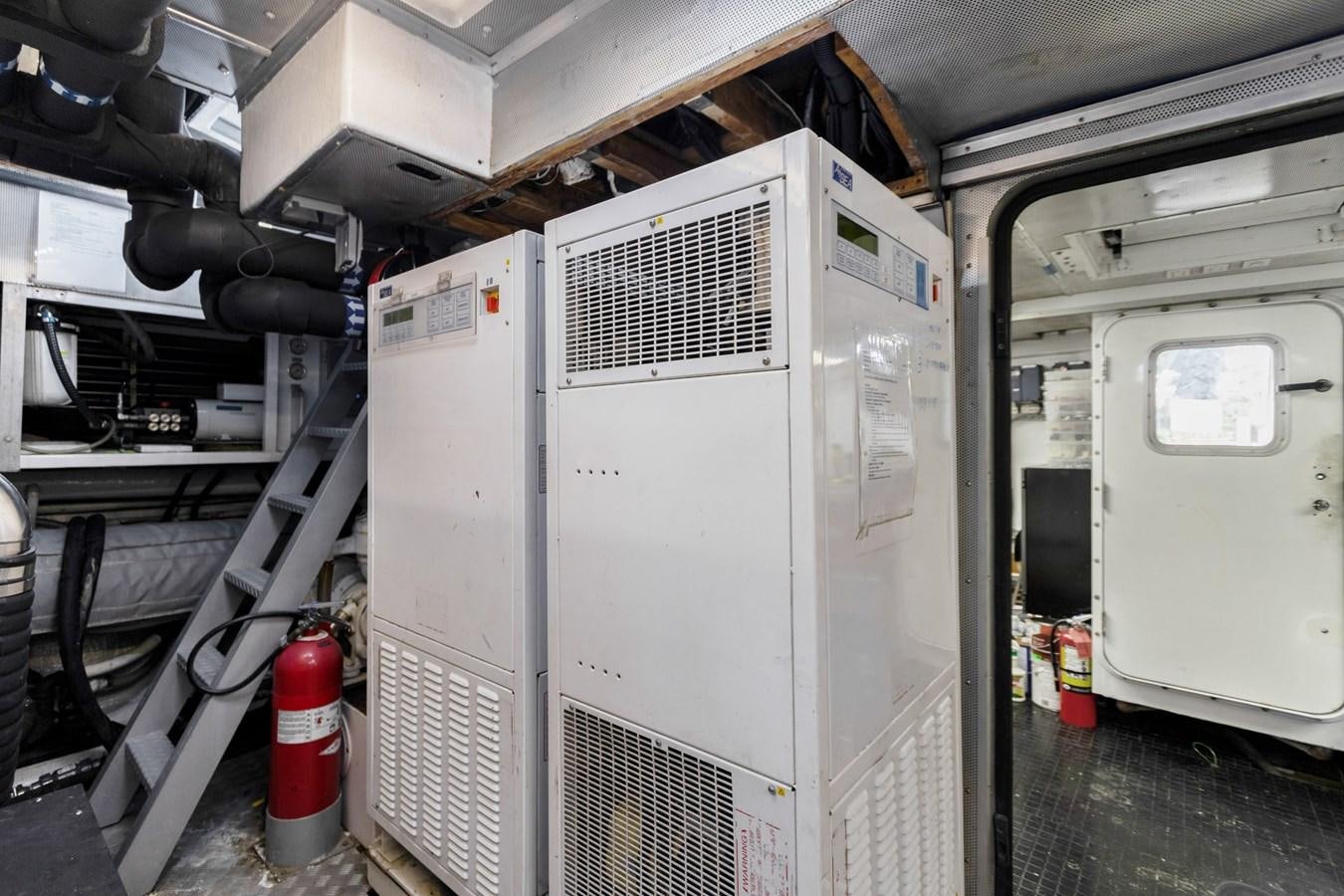 a large white machine aboard MAC Yacht for Sale