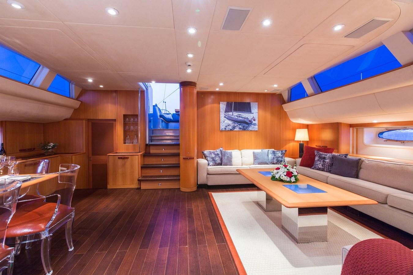 a living room with a wood floor aboard SWAGGER Yacht for Sale