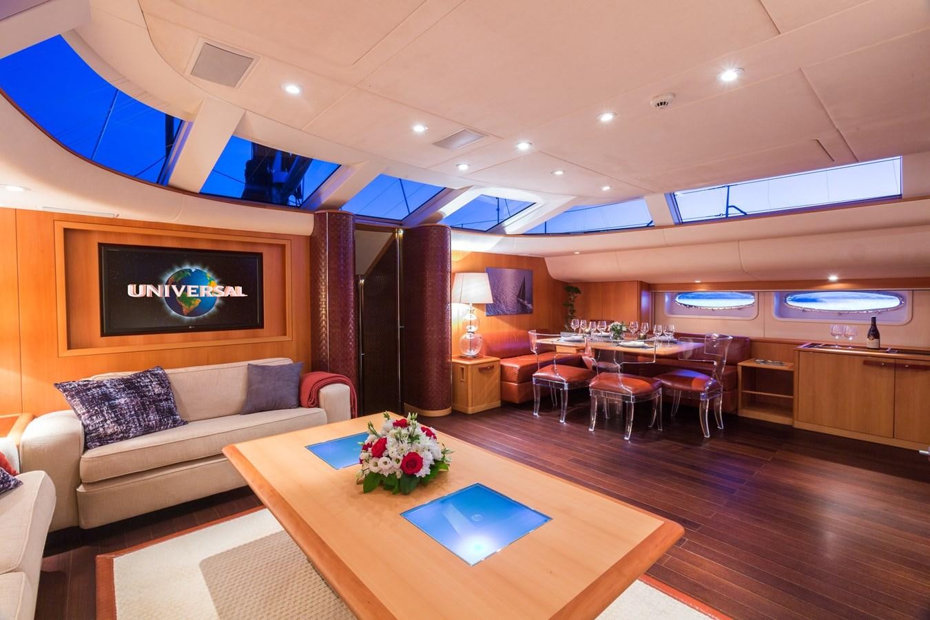 a living room with a couch and a table aboard SWAGGER Yacht for Sale