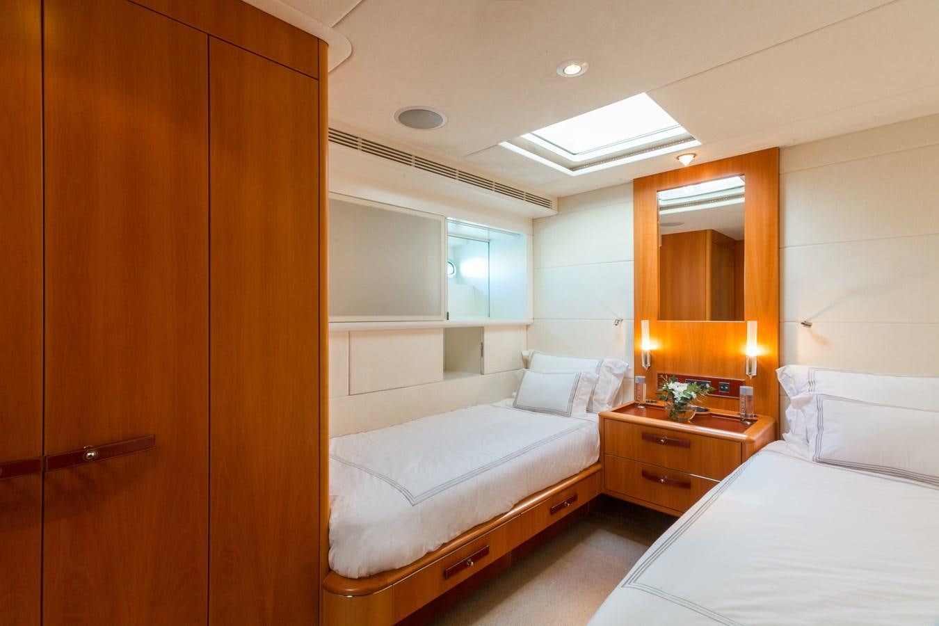 a room with a bed and a mirror aboard SWAGGER Yacht for Sale