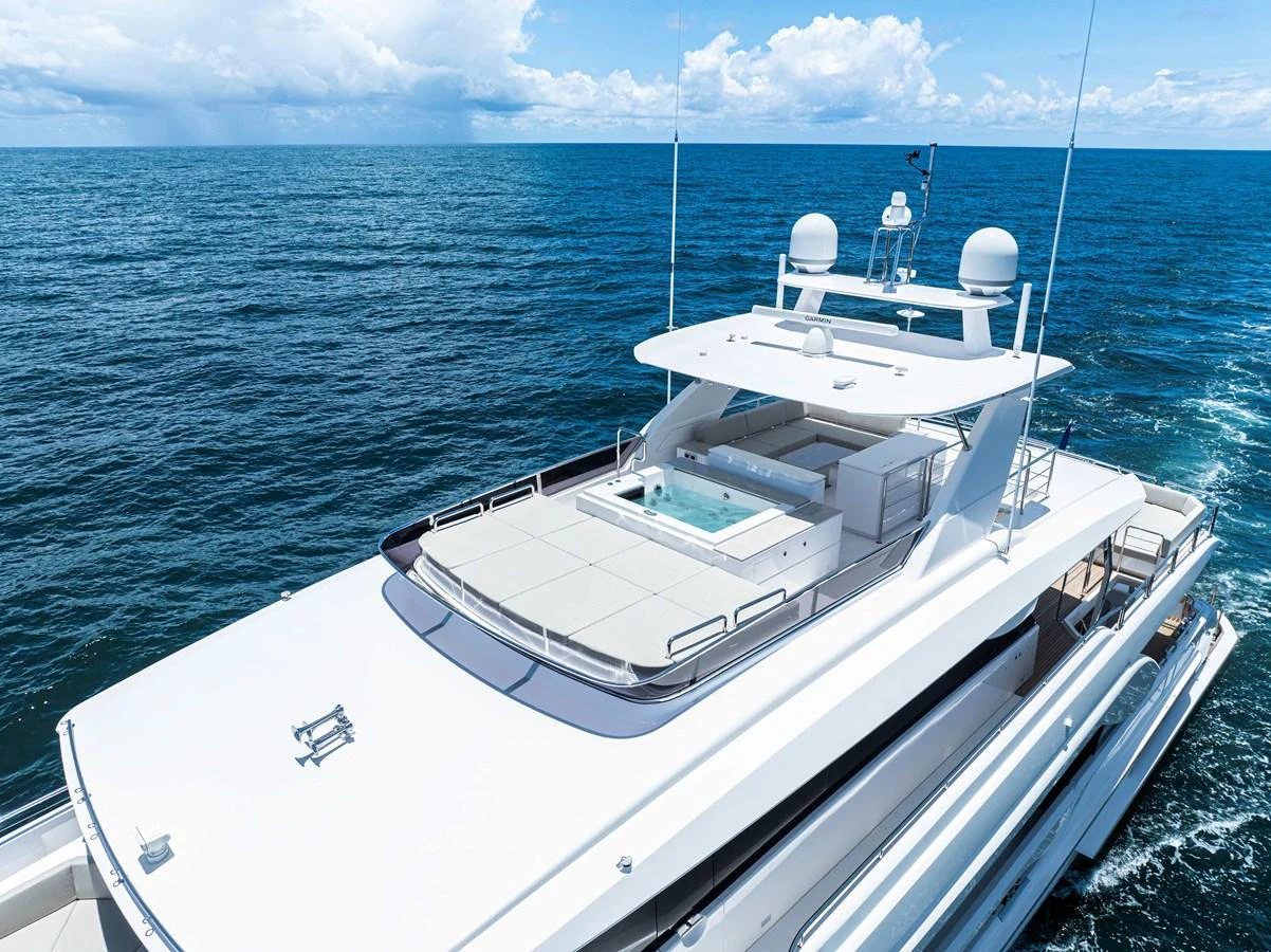 a white boat in the water aboard HORIZON FD100/911 Yacht for Sale