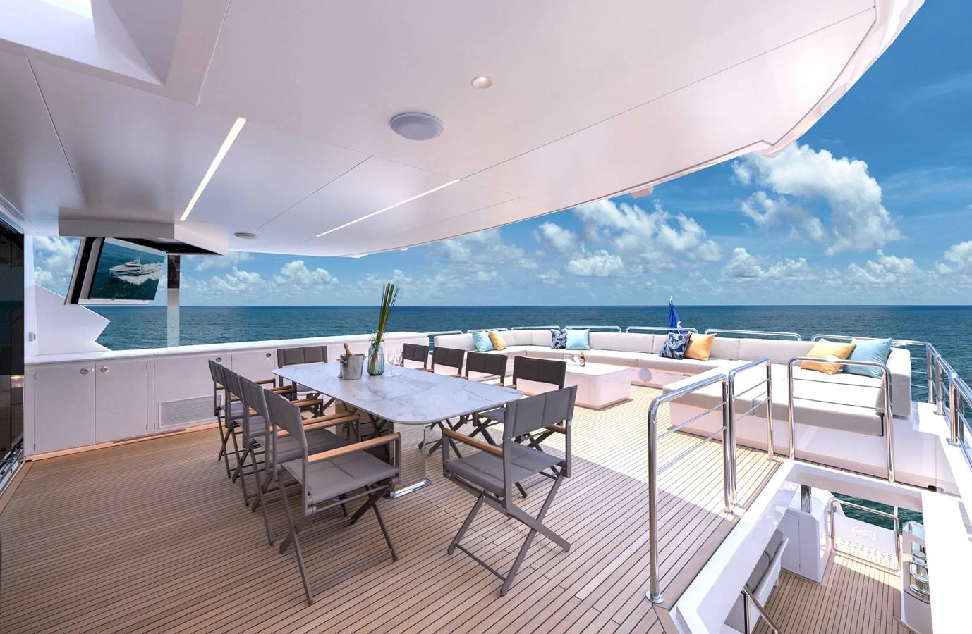 a room with a table and chairs and a view of the ocean aboard HORIZON FD100/911 Yacht for Sale