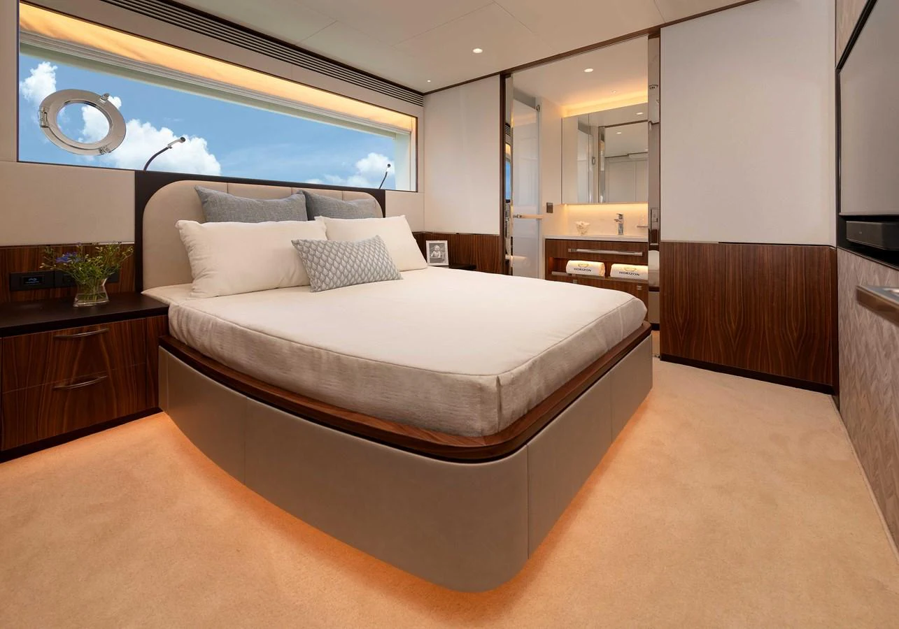 a bed in a room aboard HORIZON FD100/911 Yacht for Sale