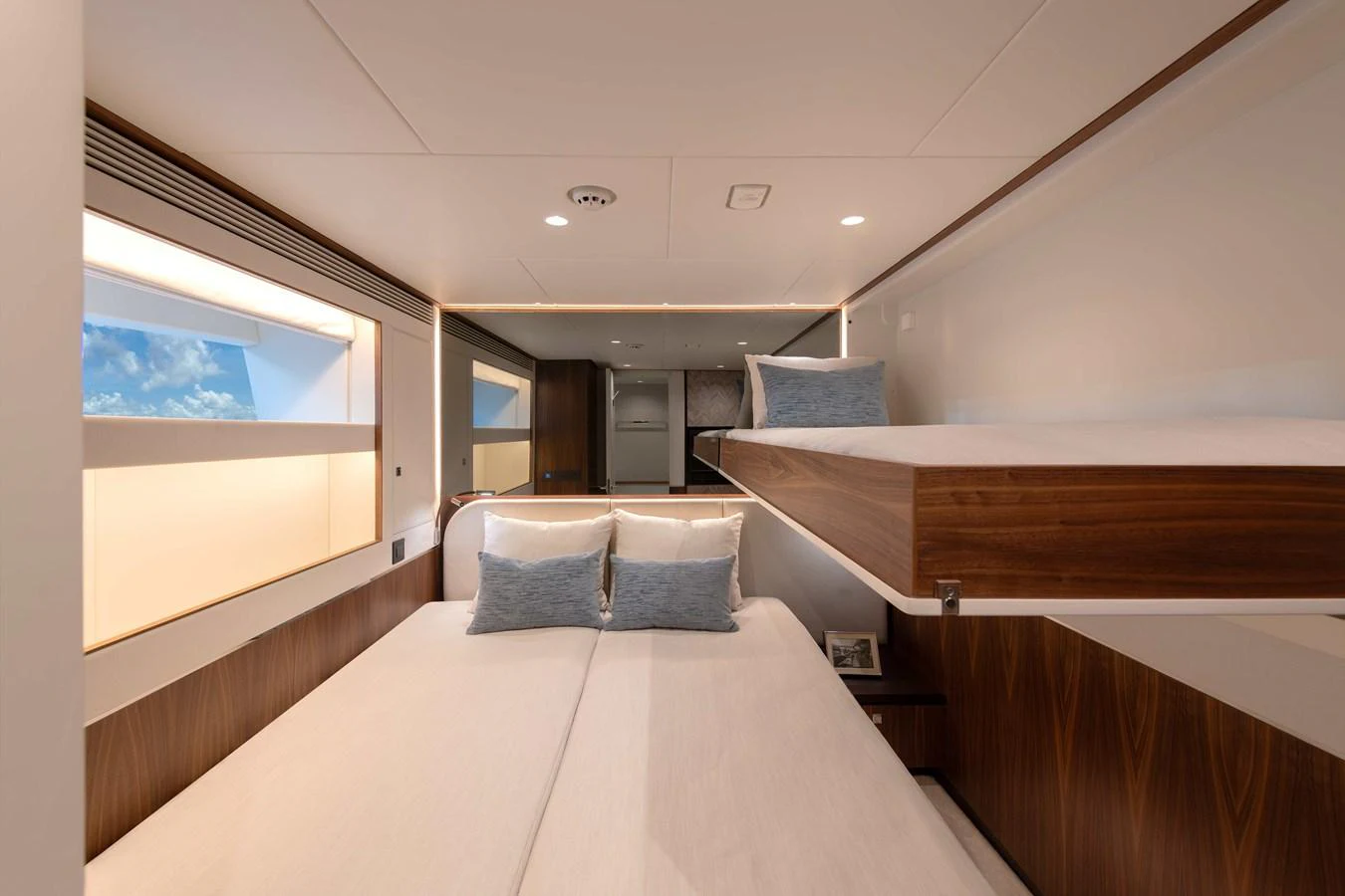 a room with a bed and a large window aboard HORIZON FD100/911 Yacht for Sale