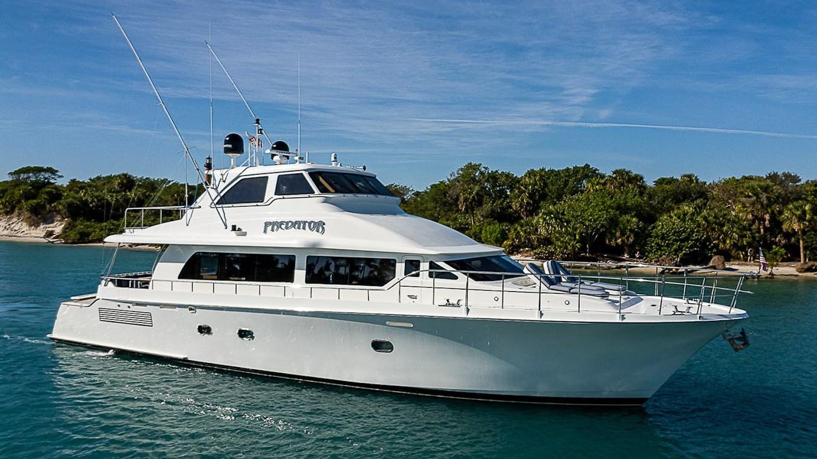 a white yacht in the water aboard PREDATOR Yacht for Sale