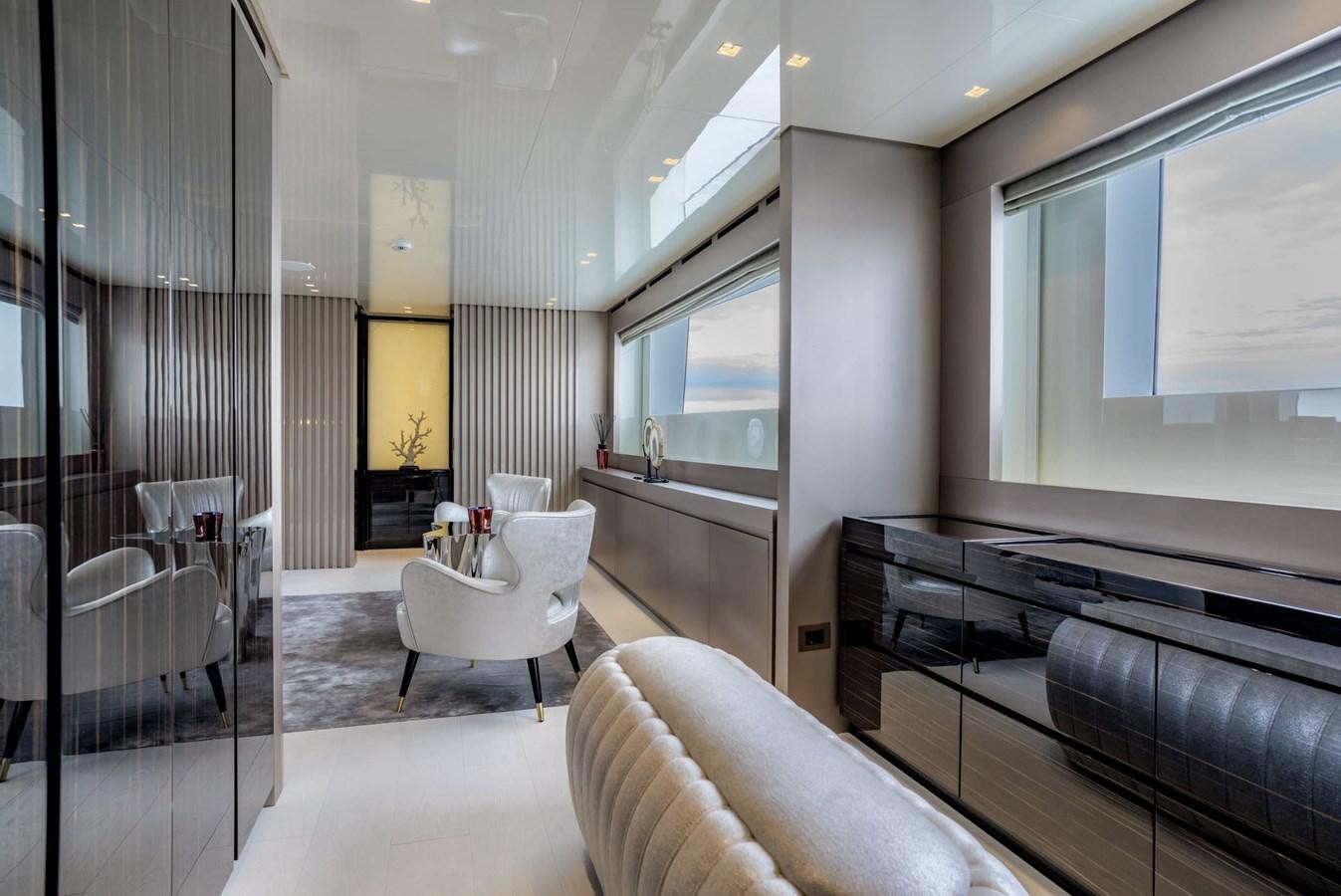 a room with a couch and a tv aboard INS LAND Yacht for Sale