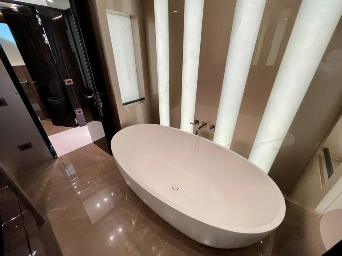 a bathroom with a large bathtub aboard INS LAND Yacht for Sale