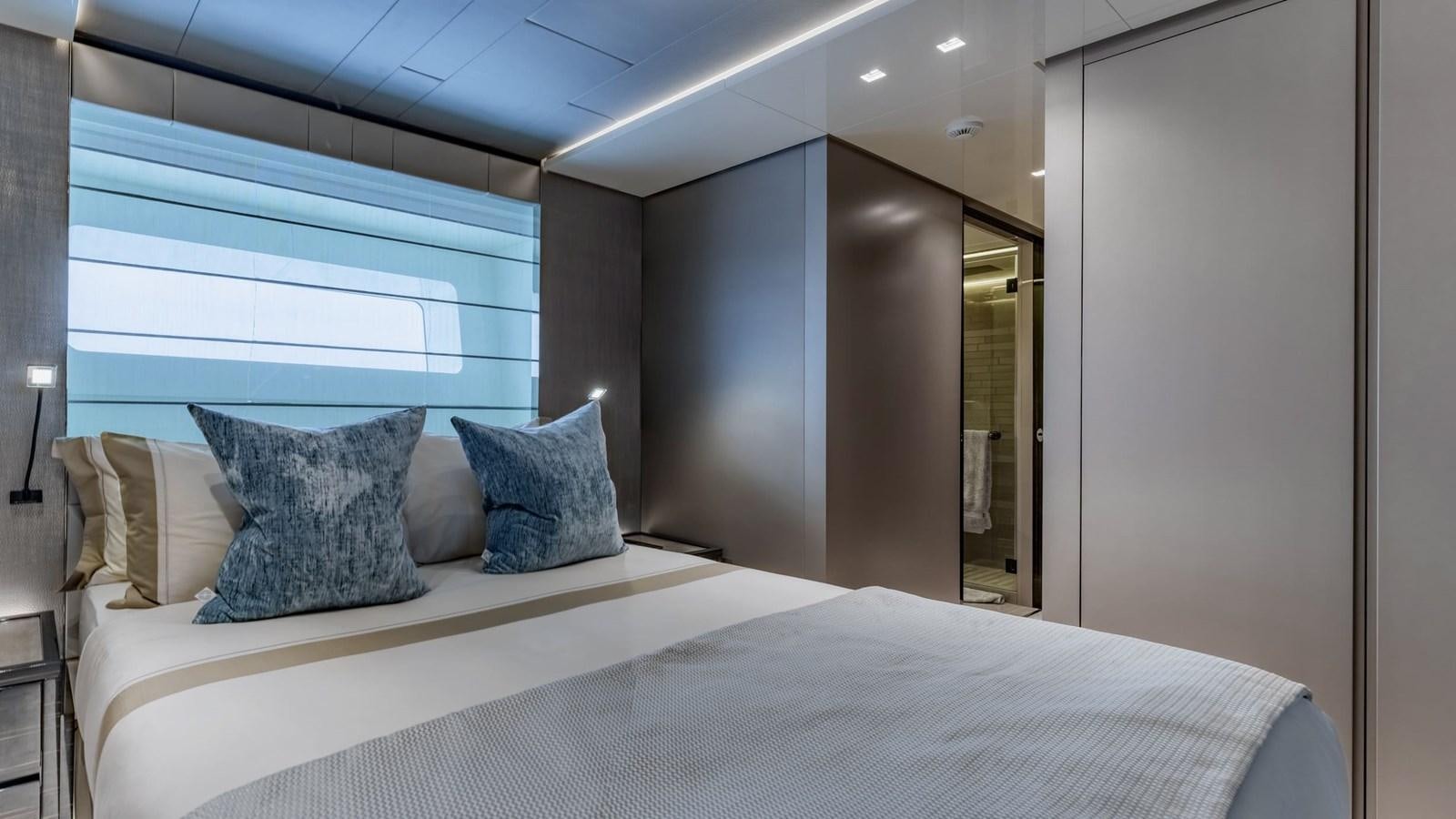 a bed with pillows aboard INS LAND Yacht for Sale