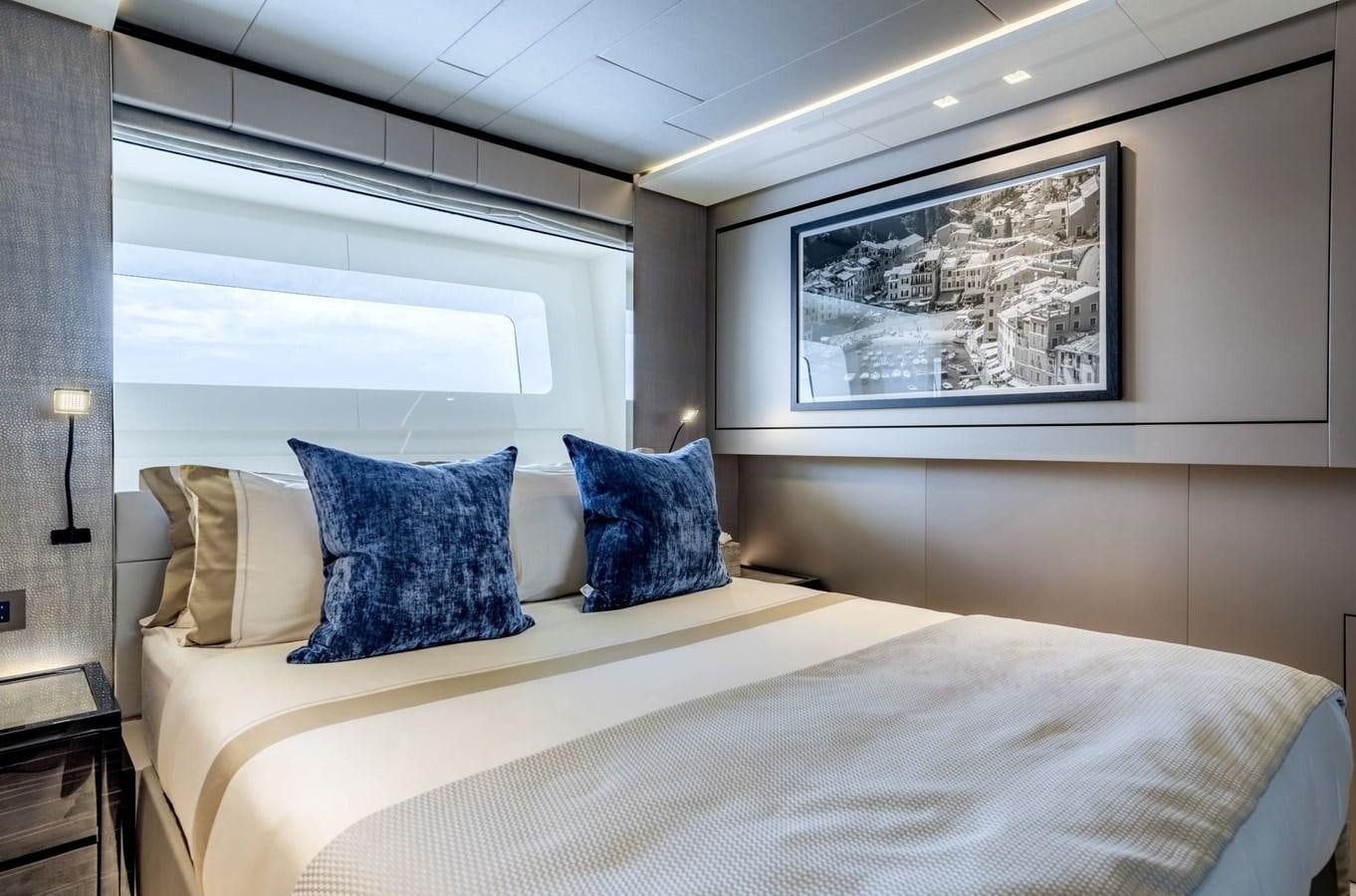 a bed with pillows aboard INS LAND Yacht for Sale