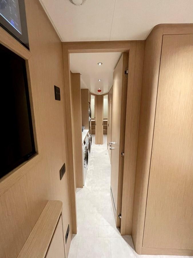 a hallway with a door and a hallway aboard INS LAND Yacht for Sale