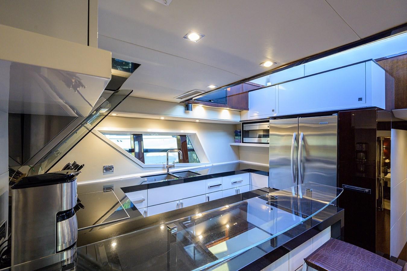 a kitchen with a large stainless steel oven and refrigerator aboard ALGORYTHM Yacht for Sale