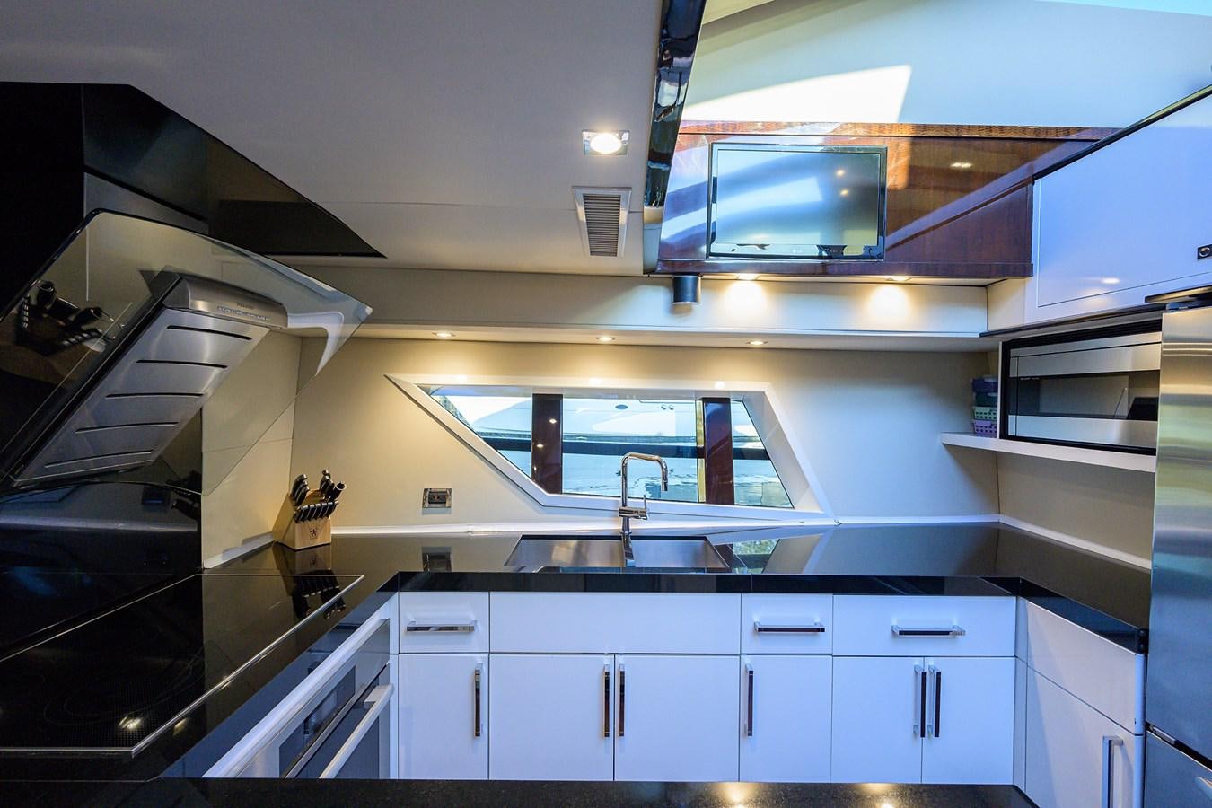 a kitchen with a large window aboard ALGORYTHM Yacht for Sale