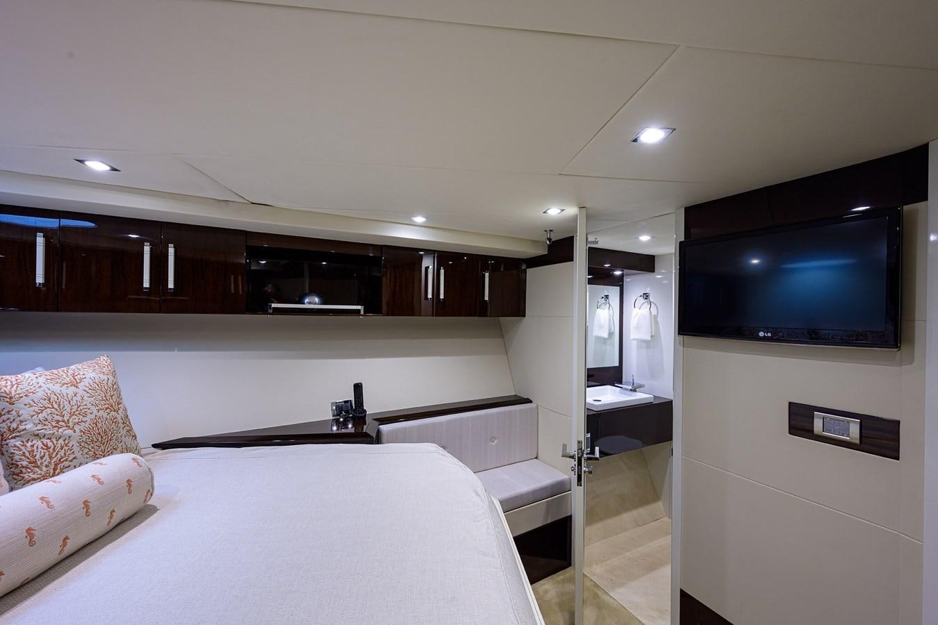a bedroom with a large tv aboard ALGORYTHM Yacht for Sale