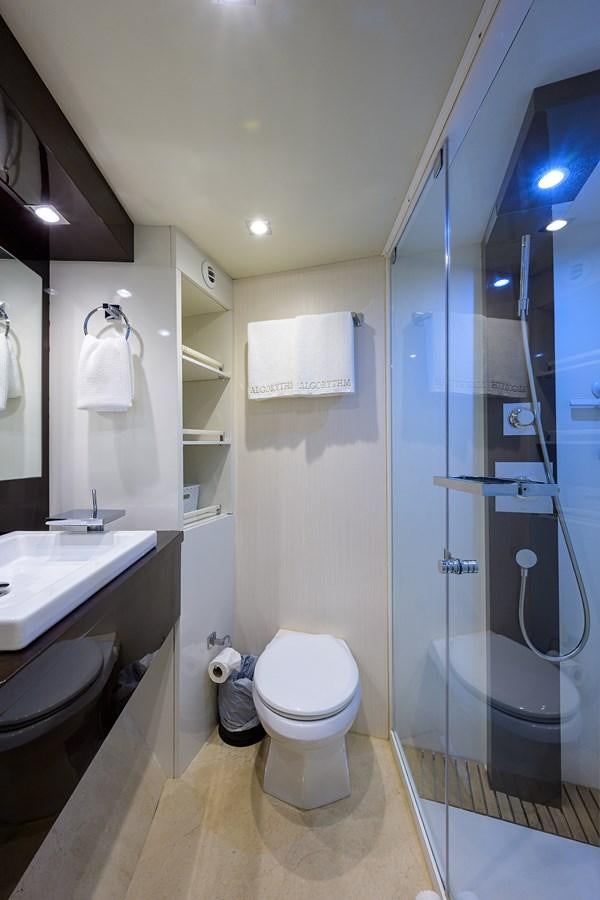 a bathroom with a glass shower aboard ALGORYTHM Yacht for Sale
