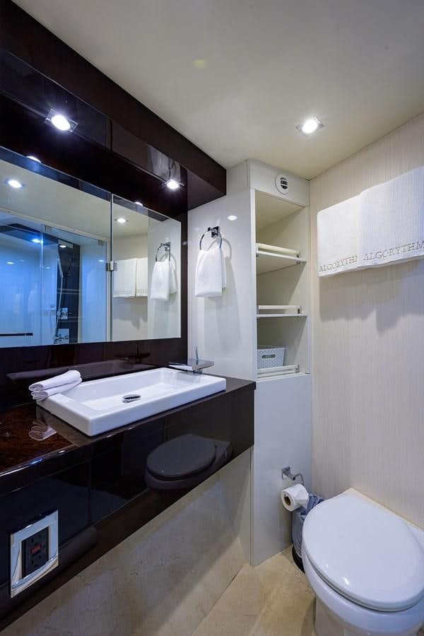 a bathroom with a large mirror aboard ALGORYTHM Yacht for Sale