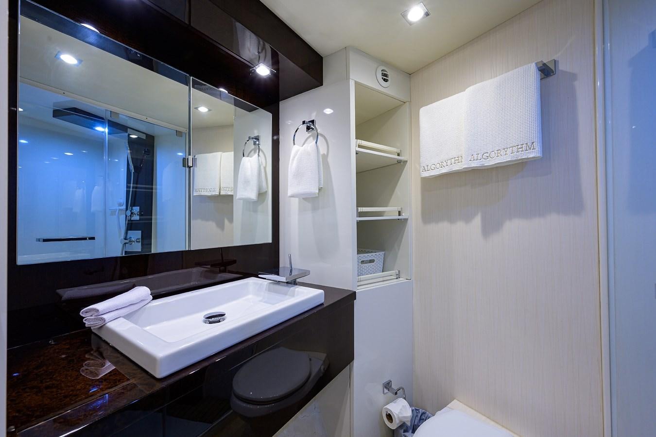 a bathroom with a large mirror aboard ALGORYTHM Yacht for Sale