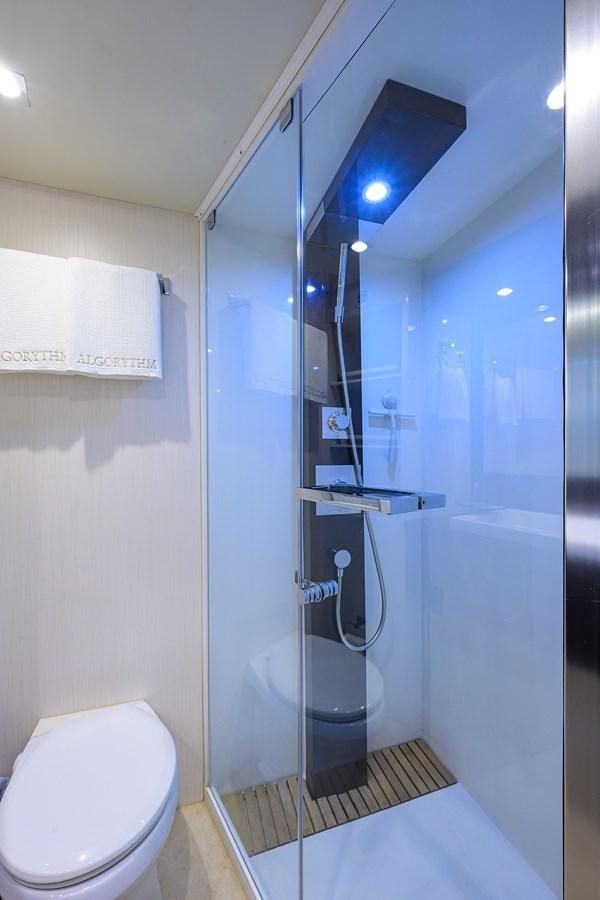 a bathroom with a glass shower aboard ALGORYTHM Yacht for Sale