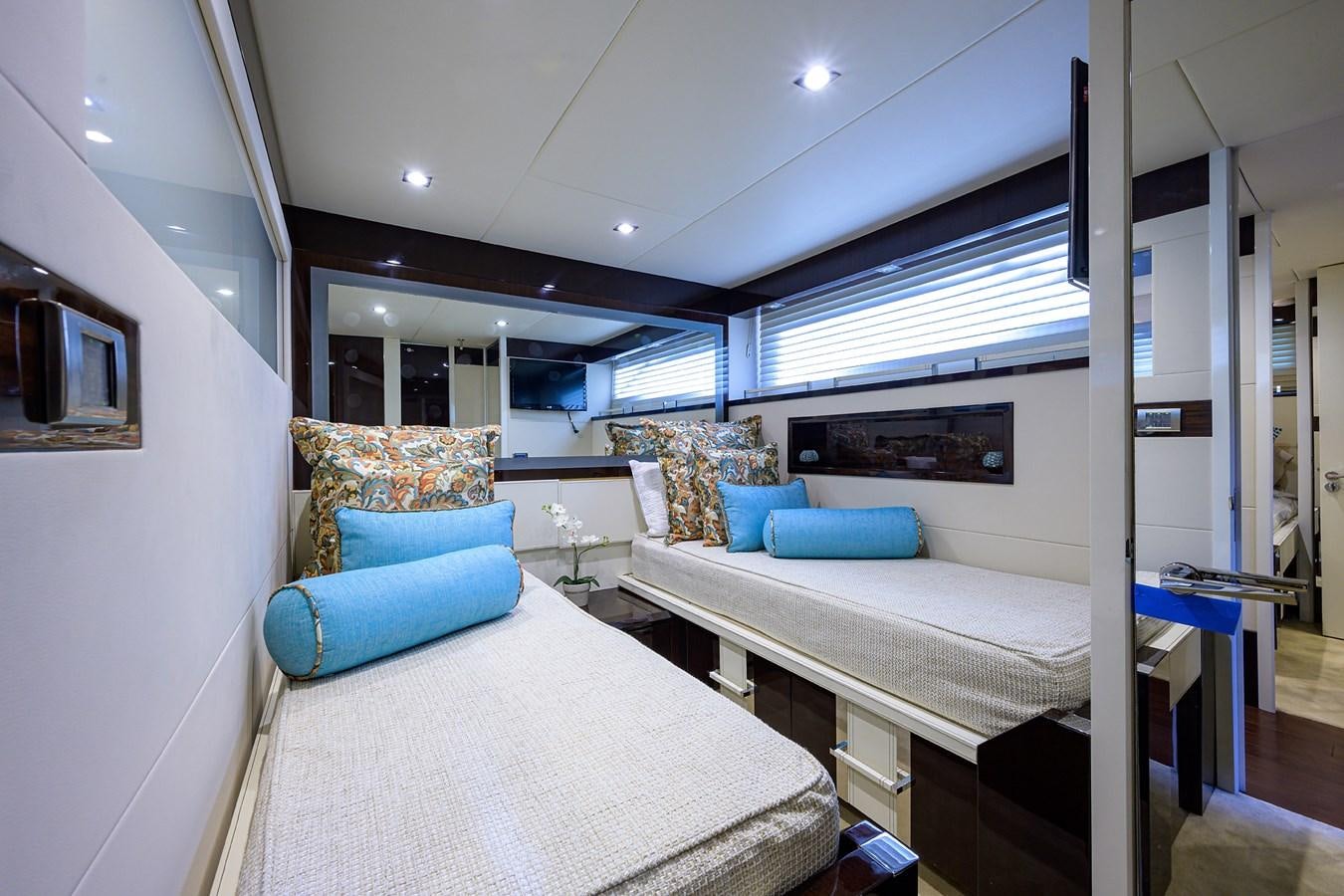 a room with a bed and a couch aboard ALGORYTHM Yacht for Sale