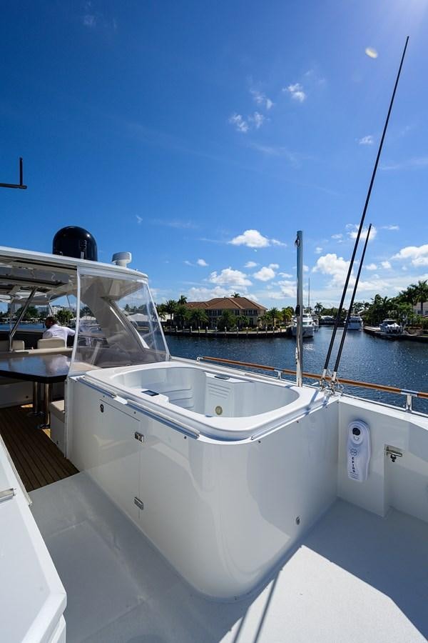 a white boat in a harbor aboard ALGORYTHM Yacht for Sale