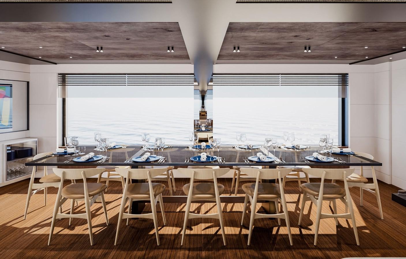 a large dining table with a chandelier aboard PICCOLO Yacht for Sale