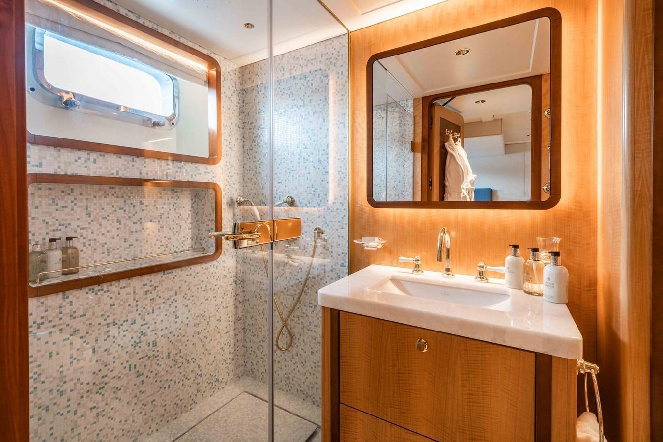 a bathroom with a glass shower aboard SYNTHESIS 66 Yacht for Sale