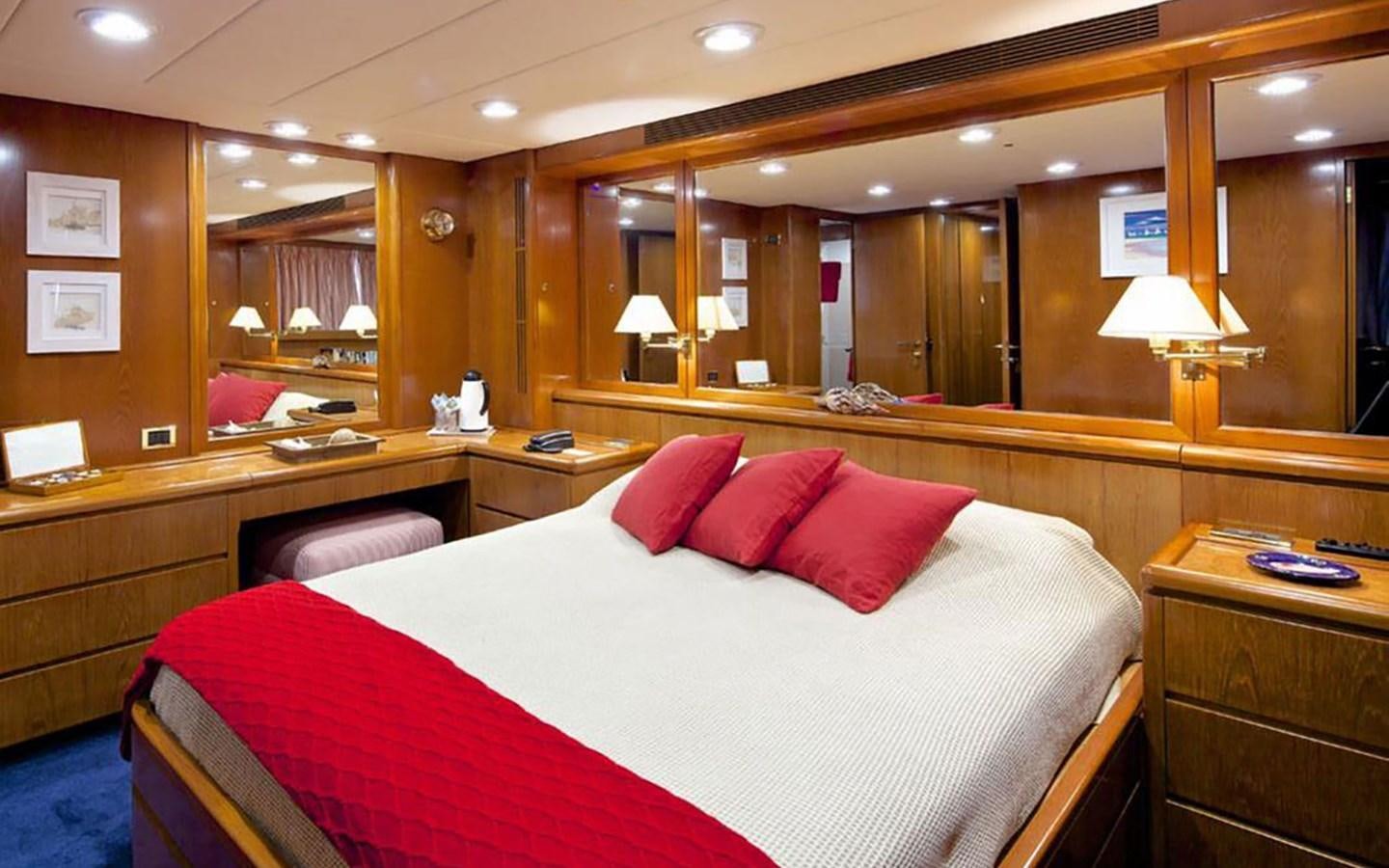 a hotel room with a bed aboard JUNESTAR Yacht for Sale