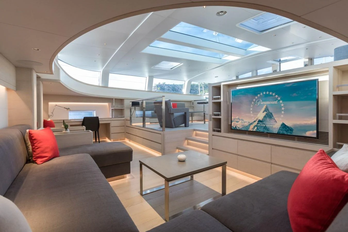 a living room with a large screen aboard G2 Yacht for Sale