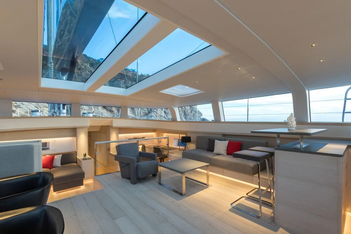 a room with a couch and a table and a window aboard G2 Yacht for Sale