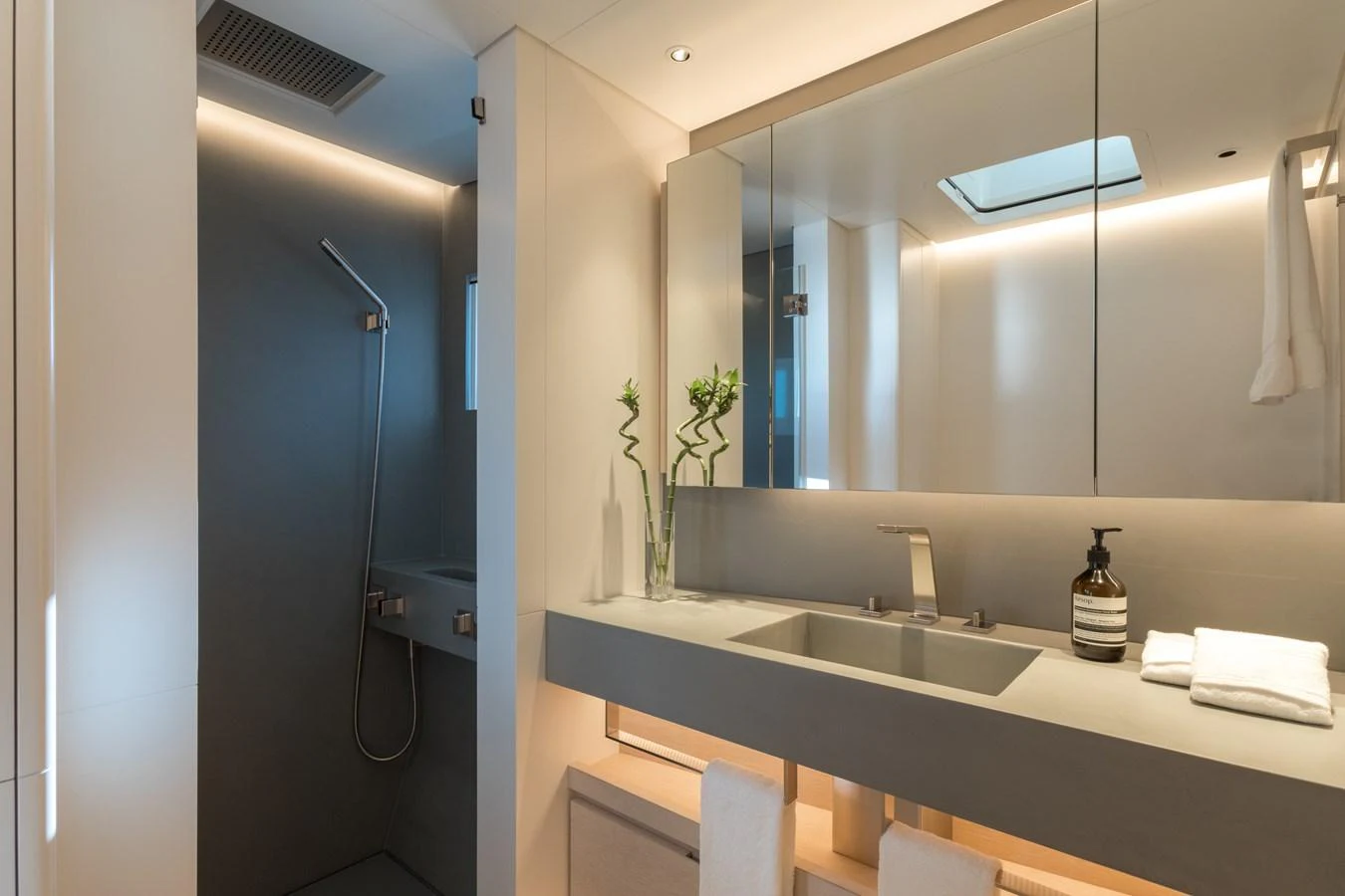 a bathroom with a sink and a mirror aboard G2 Yacht for Sale