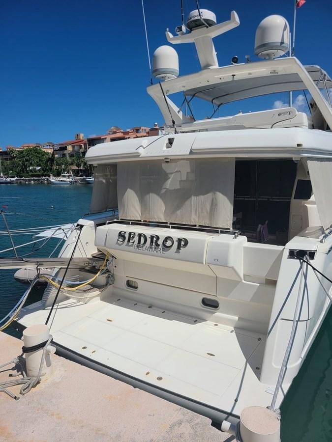 a boat docked at a pier aboard SEDROP - 2006 FERRETTI 731 @ PTO. AVENTURAS Yacht for Sale