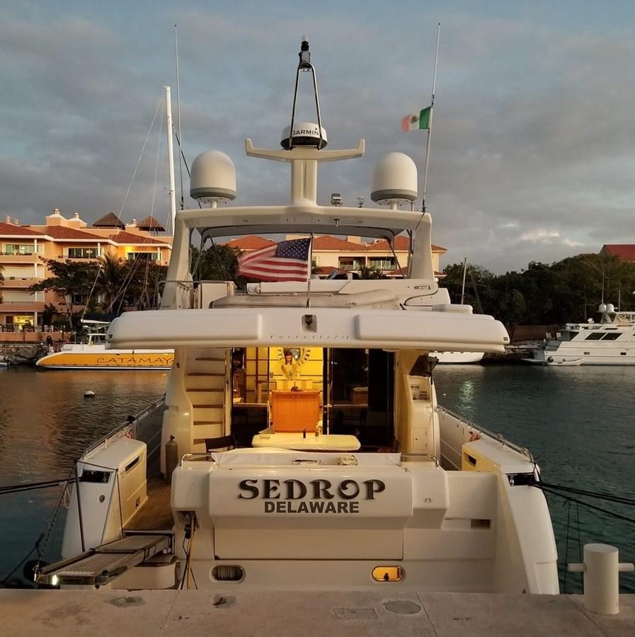 a large boat in a harbor aboard SEDROP - 2006 FERRETTI 731 @ PTO. AVENTURAS Yacht for Sale