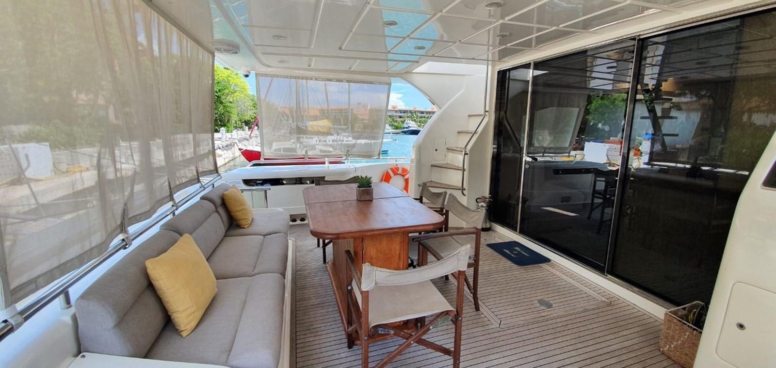 a living room with a couch and a table aboard SEDROP - 2006 FERRETTI 731 @ PTO. AVENTURAS Yacht for Sale