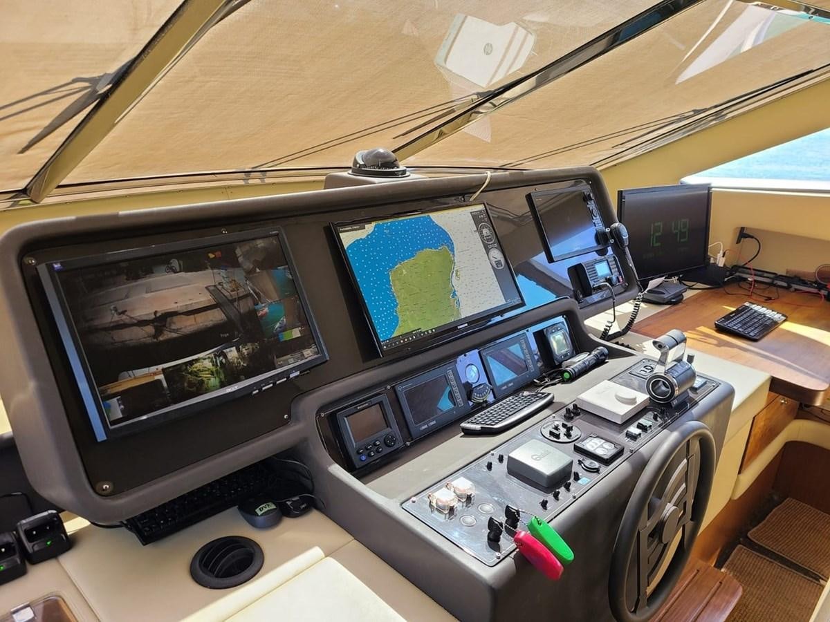a group of computers on a table aboard SEDROP - 2006 FERRETTI 731 @ PTO. AVENTURAS Yacht for Sale
