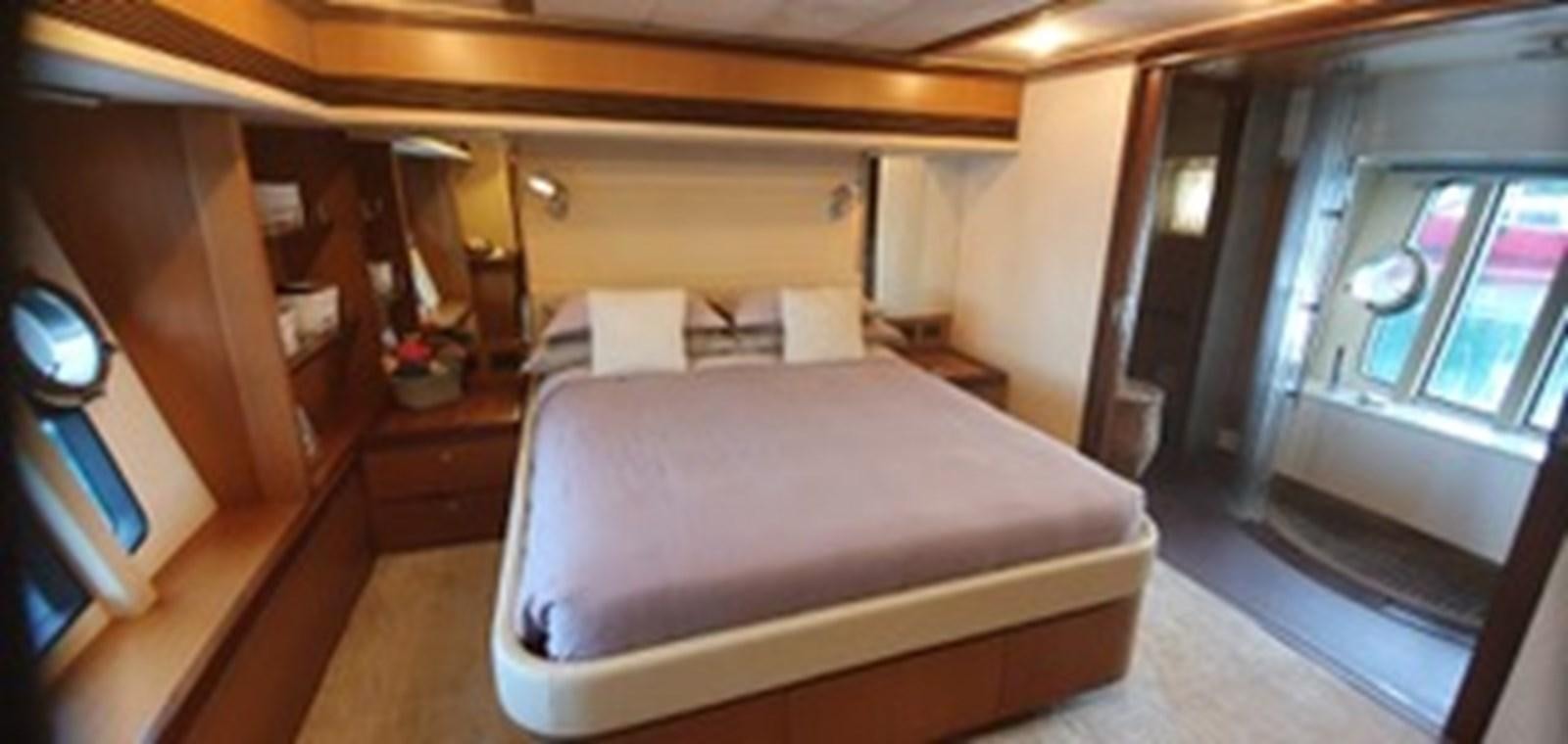 a bed in a room aboard SEDROP - 2006 FERRETTI 731 @ PTO. AVENTURAS Yacht for Sale